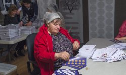 Raisa Sevastyanov prepares letter for sending them abroad