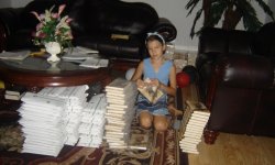 Natasha Bruyako prepares books for mailing